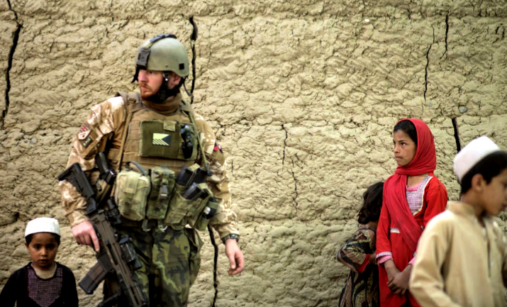 Strengthen NATO: A Czech solider is joined by Afghan children while on patrol at a village near Bagram Airfield. the US base in Parwan province