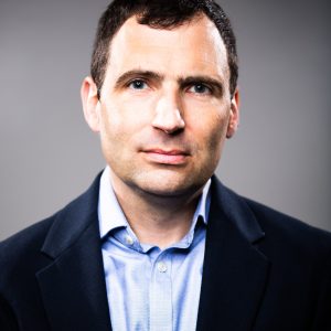 Christopher Kirchhoff | Christopher Kirchhoff portrait in blue shirt | Chartwell Speakers